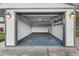Spacious two-car garage with overhead lighting and room for storage on the shelves at 5011 Se 33Rd Ave, Ocala, FL 34480