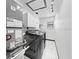 Clean laundry room features a modern washer/dryer set, storage cabinets, and a window at 5011 Se 33Rd Ave, Ocala, FL 34480
