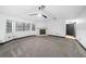 Cozy living room featuring carpet floors, a fireplace, and views of the backyard at 5011 Se 33Rd Ave, Ocala, FL 34480