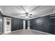 Large main bedroom with ensuite bathroom and gray walls at 5011 Se 33Rd Ave, Ocala, FL 34480