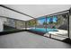Covered patio overlooking an in-ground pool and fenced backyard at 5011 Se 33Rd Ave, Ocala, FL 34480