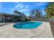 Sparkling in-ground pool with patio and fenced backyard at 5011 Se 33Rd Ave, Ocala, FL 34480