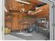 Well-organized storage room with shelving, work bench, and room for yard tools at 5011 Se 33Rd Ave, Ocala, FL 34480