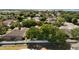 Overhead view of a serene neighborhood with tree-lined streets, well-maintained homes, and a peaceful, community-oriented atmosphere at 520 Rob Roy Dr, Clermont, FL 34711