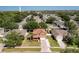 Aerial view of the house showcasing its location within the neighborhood, surrounded by lush greenery at 520 Rob Roy Dr, Clermont, FL 34711