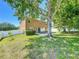 Expansive backyard with lush green grass and a charming patio, perfect for relaxing and enjoying the outdoors at 520 Rob Roy Dr, Clermont, FL 34711
