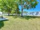 Well-maintained backyard featuring green grass, a privacy fence, and ample space for outdoor activities and enjoyment at 520 Rob Roy Dr, Clermont, FL 34711