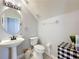 Charming half bathroom featuring pedestal sink, toilet and stylish décor at 520 Rob Roy Dr, Clermont, FL 34711