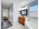 Bathroom featuring a soaking tub, single vanity with storage, and neutral paint at 520 Rob Roy Dr, Clermont, FL 34711