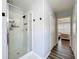 The bathroom features a glass enclosed shower, neutral paint, and a bedroom view at 520 Rob Roy Dr, Clermont, FL 34711