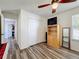 Bedroom features wood-look floors, plenty of storage, and a ceiling fan at 520 Rob Roy Dr, Clermont, FL 34711