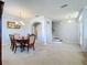 Open-concept dining area with arched doorways, tiled floors and views to the staircase and the home's entry at 520 Rob Roy Dr, Clermont, FL 34711