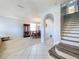 Spacious dining room features tile flooring, a chandelier, and a large cabinet for storage at 520 Rob Roy Dr, Clermont, FL 34711