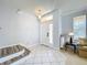 Bright entryway with tile flooring, stairs, a decorative light fixture, and ample natural light at 520 Rob Roy Dr, Clermont, FL 34711