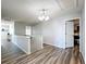 Upstairs hallway with new floor and open bedroom at 520 Rob Roy Dr, Clermont, FL 34711