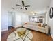 Bright living room with wood floors, view to kitchen, and designer decor at 520 Rob Roy Dr, Clermont, FL 34711
