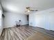 Living room features wood-look floors, plenty of storage, and natural light at 520 Rob Roy Dr, Clermont, FL 34711