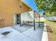 Exterior patio featuring sliding doors and a shade pergola with seating at 520 Rob Roy Dr, Clermont, FL 34711