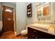 This bathroom features a standing shower, toilet, and vanity with shelves and a sink at 5495 County Road 125, Wildwood, FL 34785