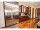 A modern kitchen boasts stainless steel appliances, wooden cabinetry, and granite counters at 5495 County Road 125, Wildwood, FL 34785