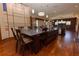 The bright kitchen features a large island with breakfast bar and dark wood cabinetry at 5495 County Road 125, Wildwood, FL 34785