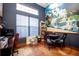 Cozy office space with hardwood floors, a window providing natural light, and an eye-catching mural at 5495 County Road 125, Wildwood, FL 34785