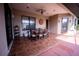 Covered patio with tile flooring, outdoor seating, ceiling fan, and natural light at 5495 County Road 125, Wildwood, FL 34785