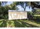 Outdoor shed surrounded by lush grass and trees providing practical storage space and blending with the landscape at 5495 County Road 125, Wildwood, FL 34785