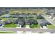 Aerial view of neighborhood showcasing homes, green lawns, and well-maintained streets at 5890 Sw 83Rd St, Ocala, FL 34476