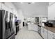 Well-lit kitchen with stainless steel appliances and an open layout at 5890 Sw 83Rd St, Ocala, FL 34476