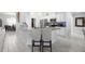 Open-concept kitchen with granite countertops and modern white cabinets at 5890 Sw 83Rd St, Ocala, FL 34476