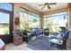 Relaxing covered patio with cozy seating, perfect for enjoying the outdoor views and fresh air at 6104 Hunters Ridge Ave, Leesburg, FL 34748