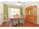 Inviting dining room with hardwood floors and a built-in hutch at 6104 Hunters Ridge Ave, Leesburg, FL 34748