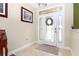 Bright foyer featuring tile flooring and a decorative front door with sidelights at 6104 Hunters Ridge Ave, Leesburg, FL 34748
