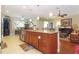 Large kitchen island with granite countertop and plenty of cabinet storage at 6104 Hunters Ridge Ave, Leesburg, FL 34748