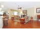 Comfortable living room with hardwood floors, ceiling fan and natural light at 6104 Hunters Ridge Ave, Leesburg, FL 34748