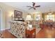 Spacious living room with hardwood floors and comfortable seating arrangement at 6104 Hunters Ridge Ave, Leesburg, FL 34748