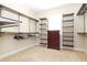 Spacious walk-in closet with ample shelving and hanging space, offering plenty of storage at 6104 Hunters Ridge Ave, Leesburg, FL 34748