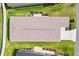 Aerial view of house highlighting the roof and green lawn at 6471 Ecoff Pl, The Villages, FL 34762