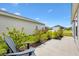 Inviting outdoor patio area with manicured landscaping, perfect for relaxation at 6471 Ecoff Pl, The Villages, FL 34762