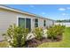 Private backyard featuring sliding door, manicured landscaping and a concrete patio at 6471 Ecoff Pl, The Villages, FL 34762