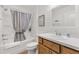 Nicely appointed bathroom featuring a single sink vanity, and shower and tub combo at 6471 Ecoff Pl, The Villages, FL 34762