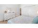 Bright bedroom with white furniture, a large dresser and a full closet at 6471 Ecoff Pl, The Villages, FL 34762