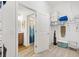 Walk-in closet with shelving, storage and access to the main bathroom at 6471 Ecoff Pl, The Villages, FL 34762