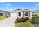 Charming single-story home with well-manicured lawn and a two car garage at 6471 Ecoff Pl, The Villages, FL 34762