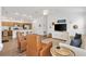 Spacious open living area featuring a breakfast bar and a well equipped kitchen at 6471 Ecoff Pl, The Villages, FL 34762