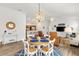 Open concept living room with adjacent dining area and well-equipped kitchen at 6471 Ecoff Pl, The Villages, FL 34762
