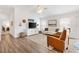 Comfortable living area with vaulted ceilings and open floor plan leading to the kitchen at 6471 Ecoff Pl, The Villages, FL 34762