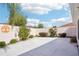 Spacious concrete backyard offers ample space for outdoor activities and beautiful landscaping at 732 Ramirez Ave, The Villages, FL 32159