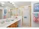 The bathroom features a shower and a sink with ample counter space at 732 Ramirez Ave, The Villages, FL 32159